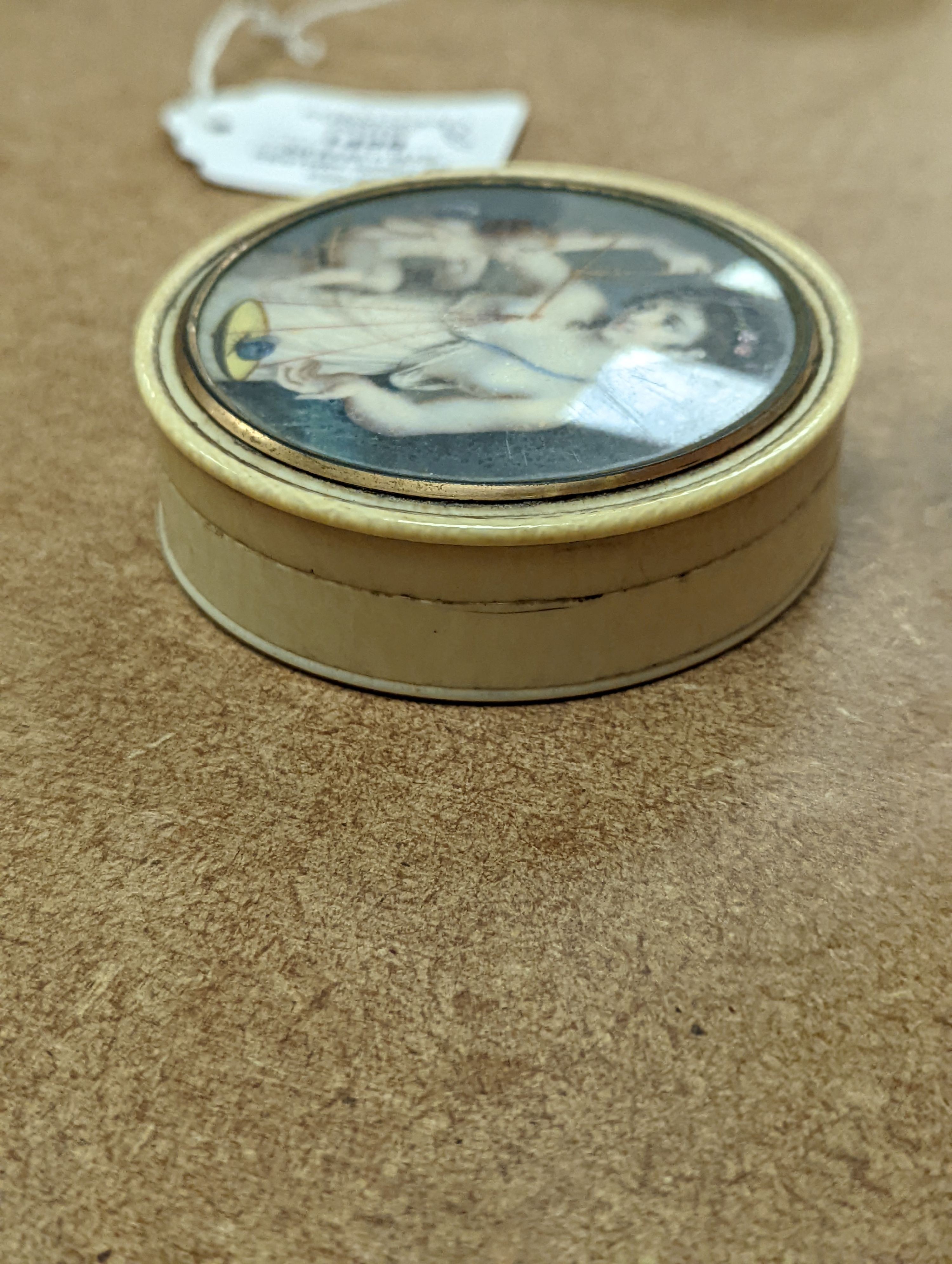 An early 19th century ivory and tortoishell box with inset miniature of Themis to cover, 8cm.